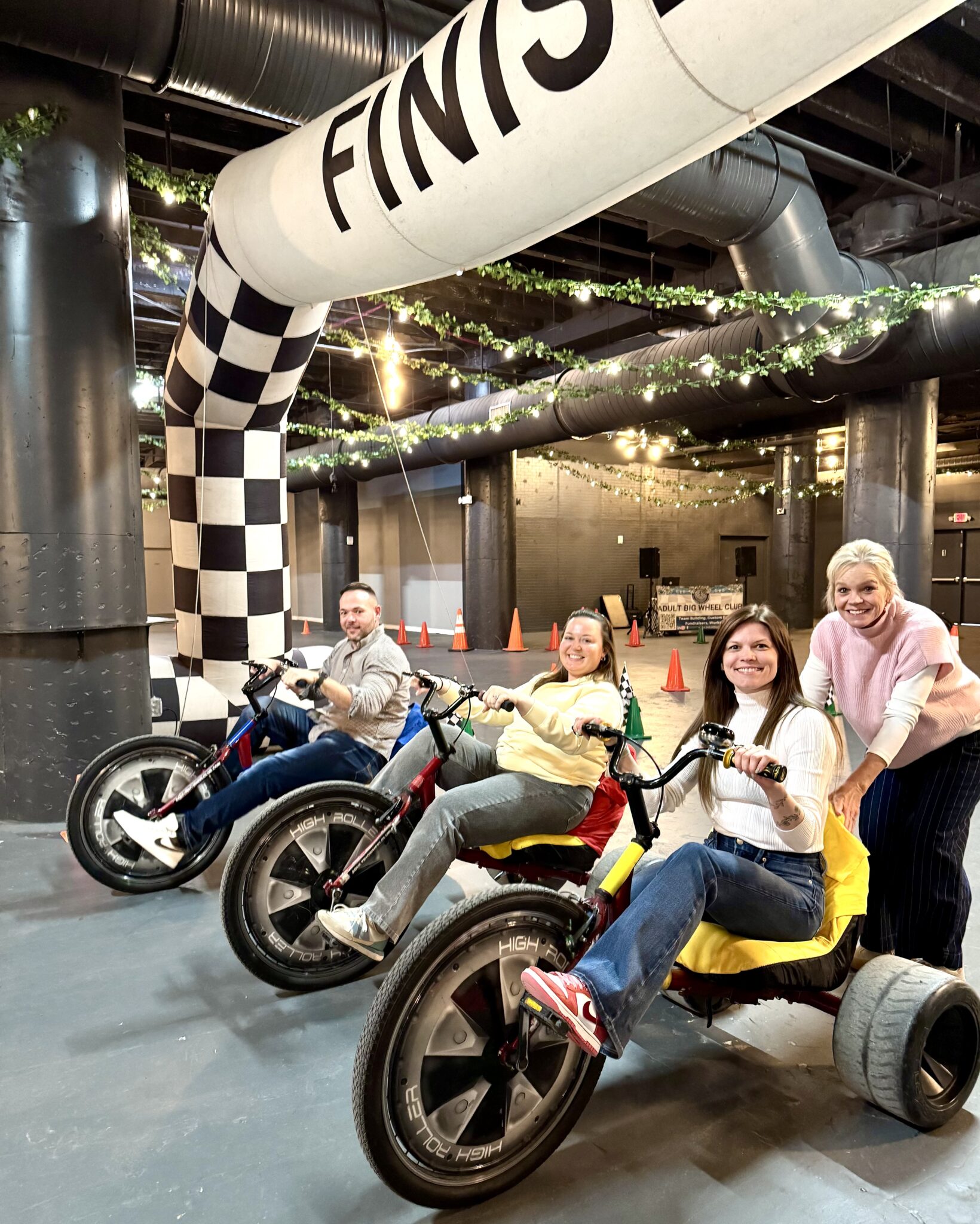 People lined up on big wheels